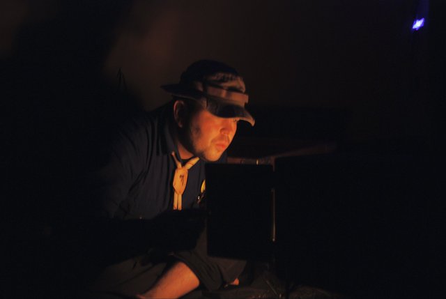 Tomas supervising the fire in the tent